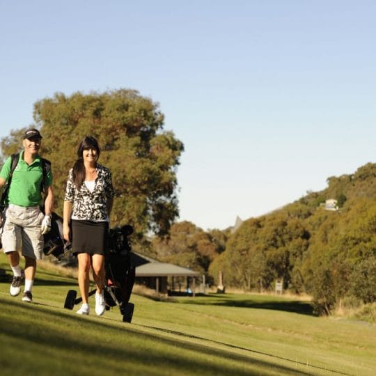 Couple enjoying a round of golf